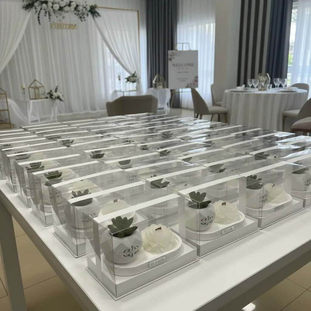 Bulk production of handmade floral souvenirs in luxury acrylic packaging for event planners and large-scale weddings in Lebanon.